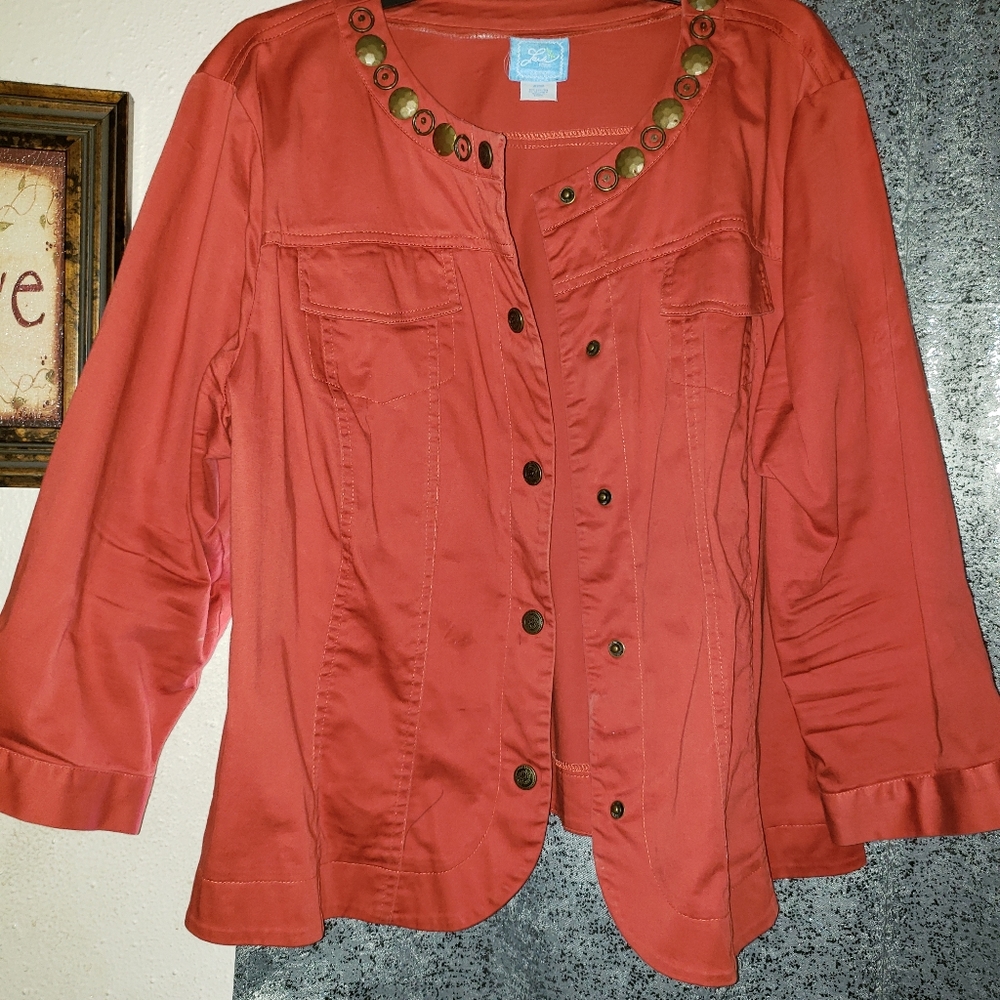 Waist length w/embellishments along collar. Nice
